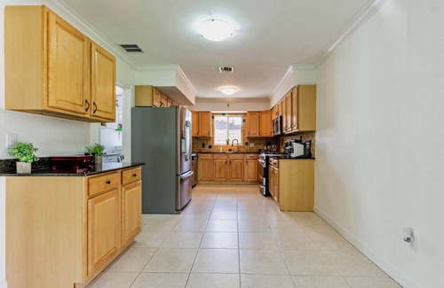 Garden Isles Casa | Waterfront home with private backyard. Heated pool with waterfall Jacuzzi