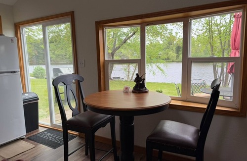 Eau Claire Casa | Waterfront legacy farm cottage house with WiFi, AC in lovely Eau Claire