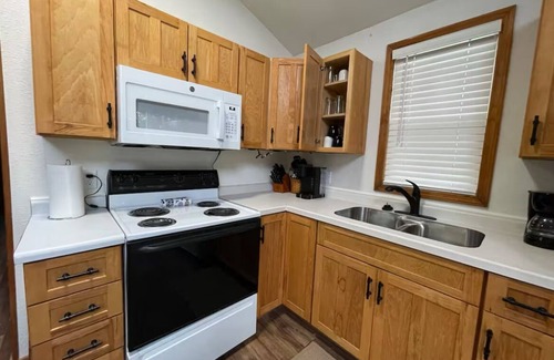 Eau Claire Casa | Waterfront legacy farm cottage house with WiFi, AC in lovely Eau Claire