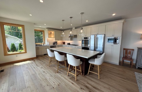 Alton Bay Casa | Waterfront New Construction 4 bedroom home w private U shaped dock Private beach