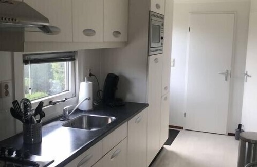 Breskens Casa | "Welcome to Chalet Huis Joschi: your dream vacation by the North Sea!"
