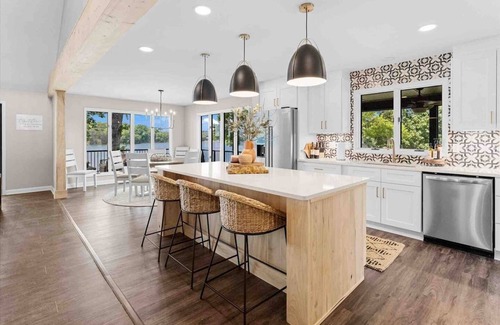 Mooresville Villa | Whiskey Sunsets: Stunning Peninsula Retreat with Panoramic Lake Views, Dock, Hot Tub, and More!