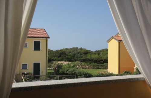 Pirotto Li Frati Apartamento | Apartamento "WHITE & SWEET HOME" frente al mar con piscina