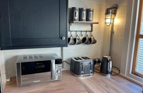 Chwilog Cabina | White River Retreats luxury lodges with Private Wood Fired Hot Tub