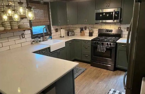McHenry Casa | Wisp-ering Hideaway: 5 min to Wisp, covered hot tub, 2 firepits, Dogs, Arcade!
