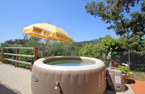 Castiglione della Pescaia Casa | Casa de vacaciones privada con jacuzzi, A/C, TV, veranda, vista panorámica, aparcamiento