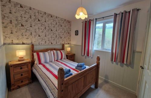 Burgh Island Chalet De Esquí | Woodcutters Lodge set in a secluded valley near Bantham
