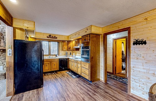 Gnaw Bone Casa | Wooded acreage with wrap-around deck, hot tub, central AC, & game room