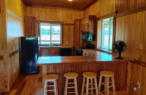 Gerry Cabina | Woodys Retreat this rental includes the barn outdoor covered fire pit