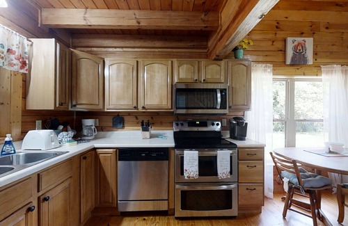 Newport Cabina | Yellow Cabin On The River 2 Bedroom Cabin by RedAwning