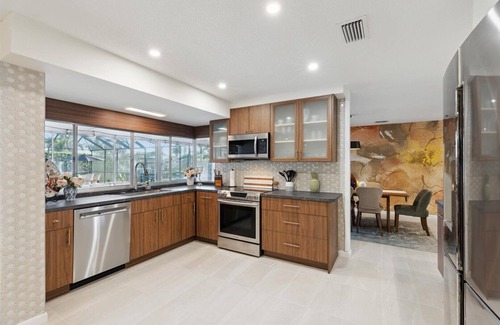 Venetian Way Casa | Your Ultimate Coastal Retreat! Stunning 4-Bed Canal-Front Home w/Pool & Lanai