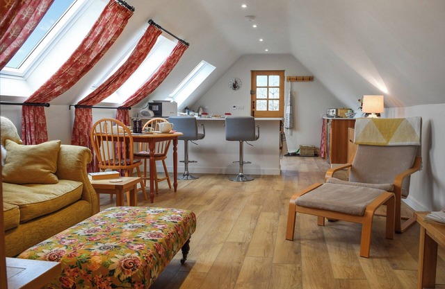 A fabulous and spacious loft apartment overlooking the orchard, fields and countryside beyond.