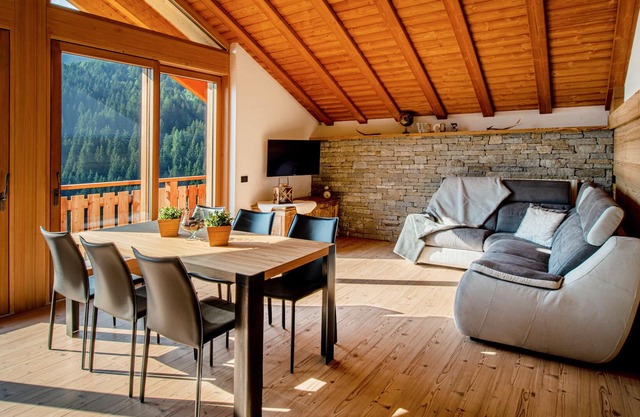 Apartamento 'Attico Pradella Apartments' con vistas a la montaña, terraza compartida y Wi-Fi