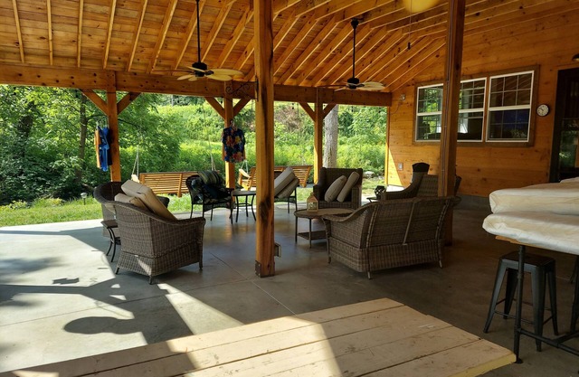 Cabin is 1 mile off I-26 along side S Indian Creek, which is stocked with trout.