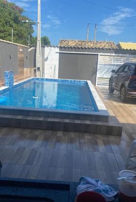 Casa em itanhaem com piscina, churrasqueira a poucos minutos da praia