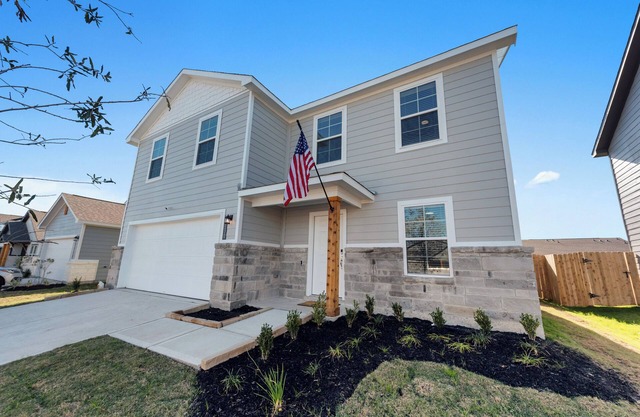 Charming 4-bedroom house with movie room, game room, outdoor patio + fire pit