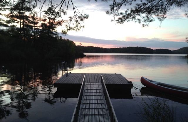 Classic lakefront family camp in Camden; large porch, dock & boats