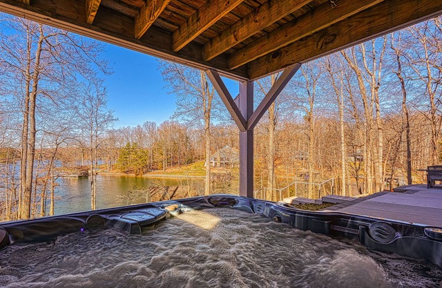 Dog-friendly lakefront home with hot tub, dock, kayaks, & game room