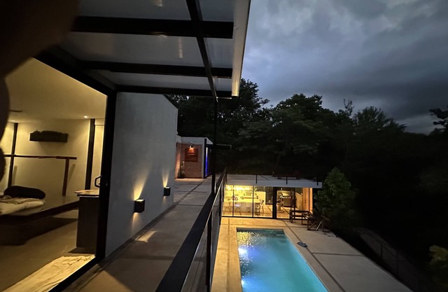 Enjoy privacy and nature in this open concept home and relaxing pool.