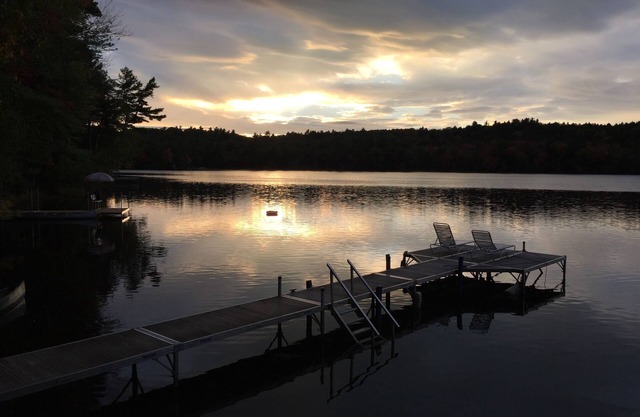 Fall colors at a Maine Lakefront cottage. Watch the beautiful change of seasons