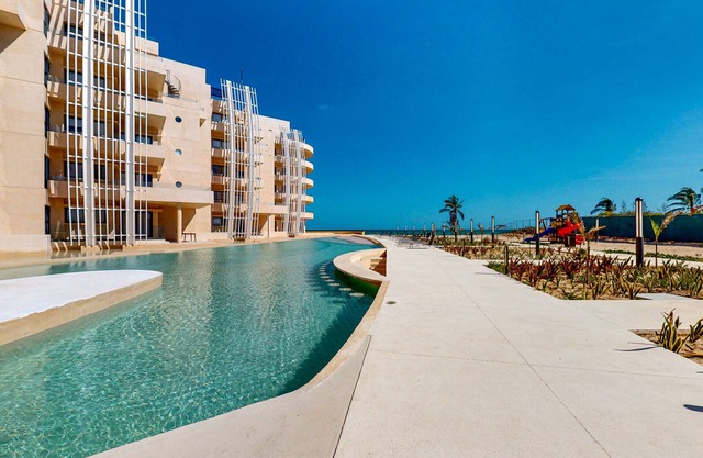 Gulf-view getaway with a furnished terrace, pool, & easy beach access