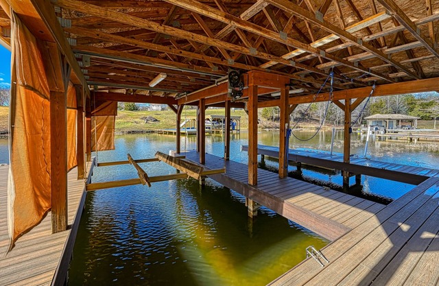Impressive lakefront home with private dock, 2 boat slips, firepit, deck, grill