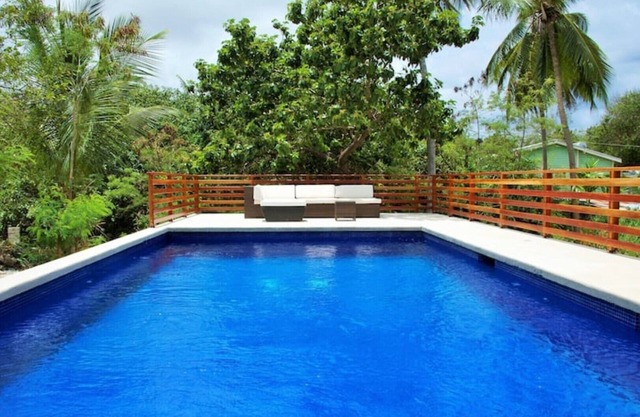 Large modern villa with pool on West Coast near beach & restaurants w/ parking.