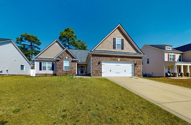Lovely home with screened-in patio, fireplace, pool, playground, & gym access