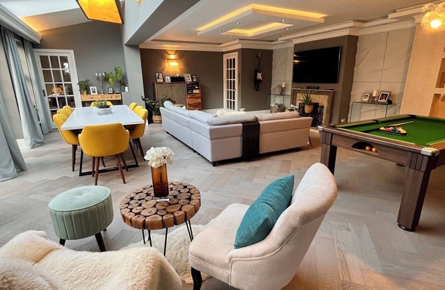 Luxury family home in Surrey, UK with garden, pool table, fireplace & playground