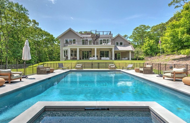 Modern-style home with heated private pool, open-floor plan, ample natural...