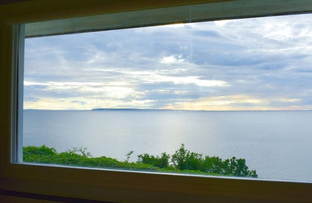 Peaceful Beachfront Getaway with Sweeping Water Views