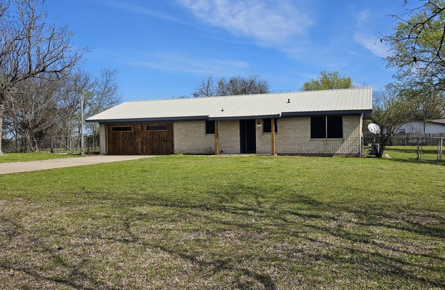 Private home with **GAME ROOM** on over half an acre of land!