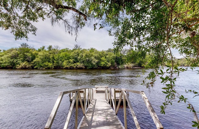 Riverfront dog-friendly home w/ boat slip, firepit