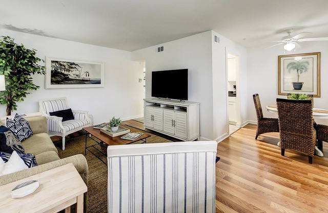 Riverside condo with pool, kayak launch, dock, AC, & W/D - dog-friendly