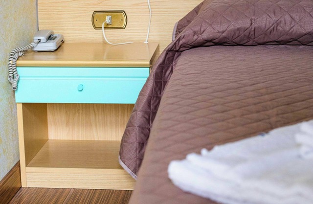 Habitación 'Tripla - Letti Singoli' con jardín compartido, Wi-Fi y aire acondicionado.