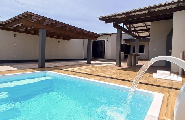 Casa sola en el patio con dos habitaciones y Wi-Fi En Capão Da Canoa