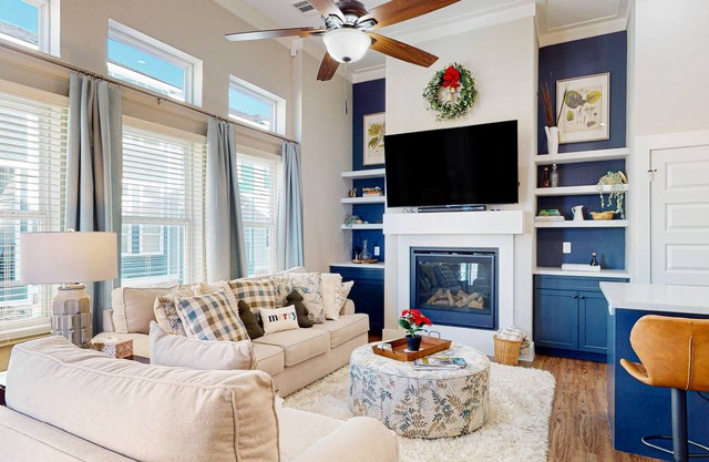 Sleek, modern home in quiet location with fireplace, W/D, balcony, & AC