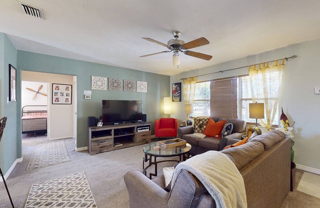 Snowbird-friendly home with enclosed yard, deck, grill, central AC