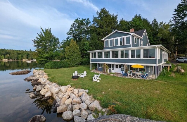 Stunning lakefront home with 270° water views and private beach near Acadia