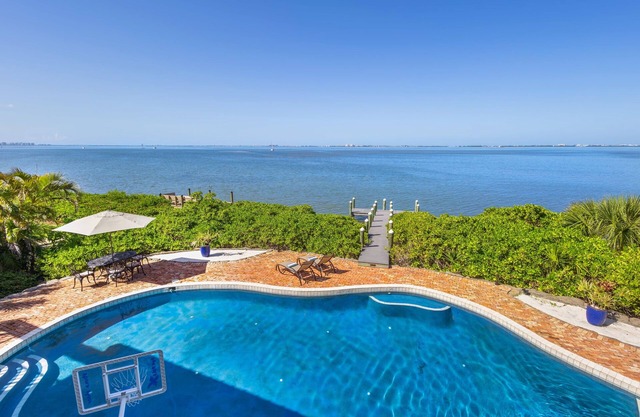 Stunning waterfront retreat w/ panoramic view, spectacular sunsets & Heated pool
