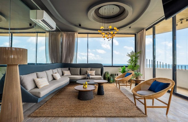 Surreal coastal apartment with local design, shared pool & private jacuzzi