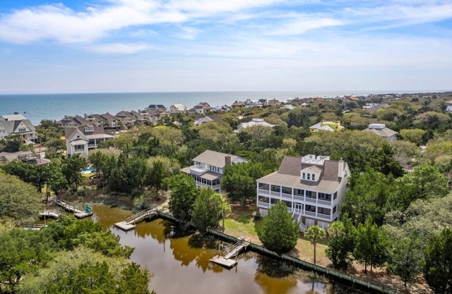 This vibrant family home features 8 bedrooms, and 8 bathrooms, ocean and creek views