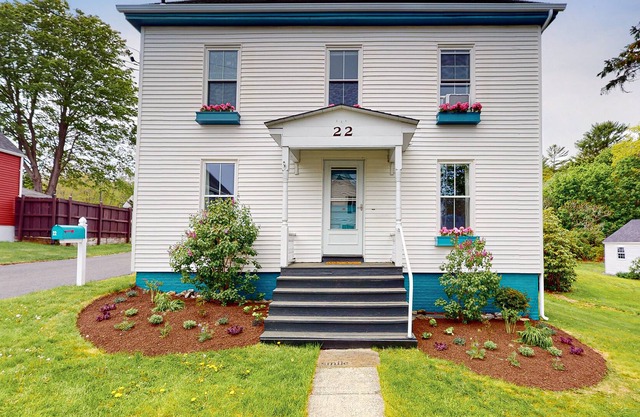 Updated, dog-friendly home with two living areas, firepit, washer/dryer, & patio