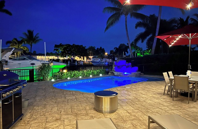 Waterfront home with private backyard. Heated pool with waterfall Jacuzzi