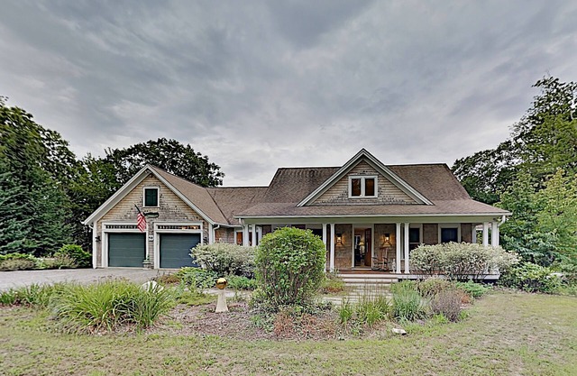 Woodland hideaway with lake access, private game room, fireplace, & luxe kitchen