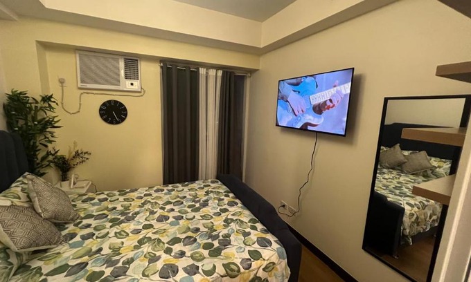 A. Bonifacio Apartamento | 1-BR Condo Unit at The Celandine with Refreshing Balcony-view of the Pool