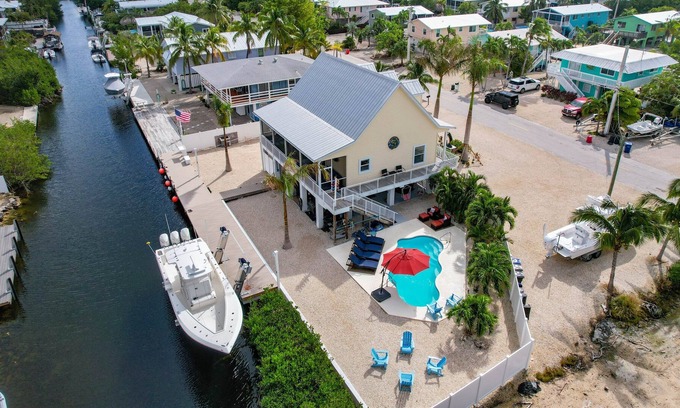 Breezeswept Beach Estates Casa | 3 Bed/2 Bath Canal Front Home in Ramrod Key 80' Dock and Pool