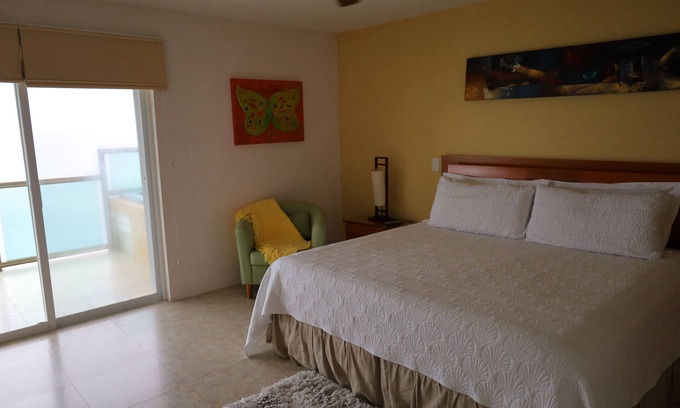 Colonos Cuzamil Condominio | 4/4.5 Condo Oceanfront Cozumel Downtown AC WiFi Security