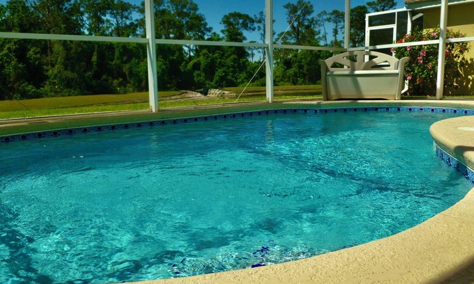 Haines City Casa | 4 bed/3 bath house with private pool overlooking a lake and nature preserve.