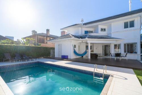 Jurere Internacional Casa | Casa 4D c/piscina en Jurerê Internacional MER0671